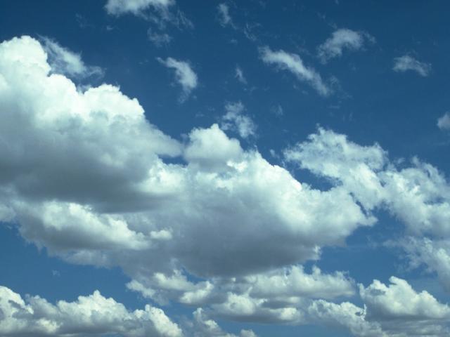 Both summer and winter clouds are flying in the sky