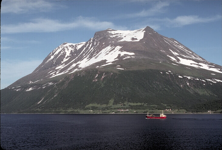 Lake, mountain above and red ship