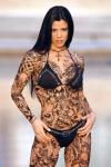 Woman's tatu with dragons and skull