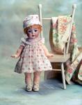 Doll child with chair