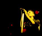 photo by Dave Gahan concert in the yellow-red searchlights